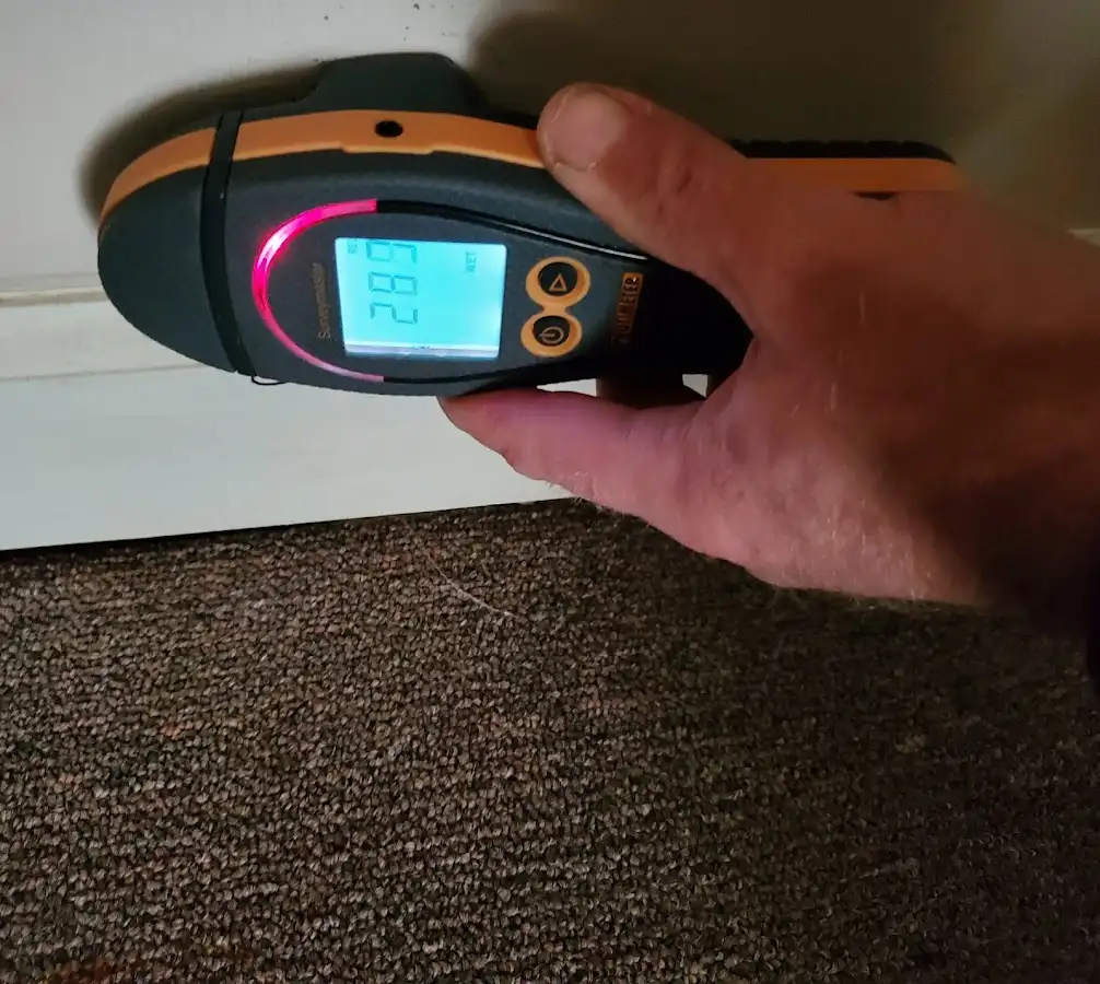 Moisture detection at baseboard during Storm Damage Restoration in South Milwaukee